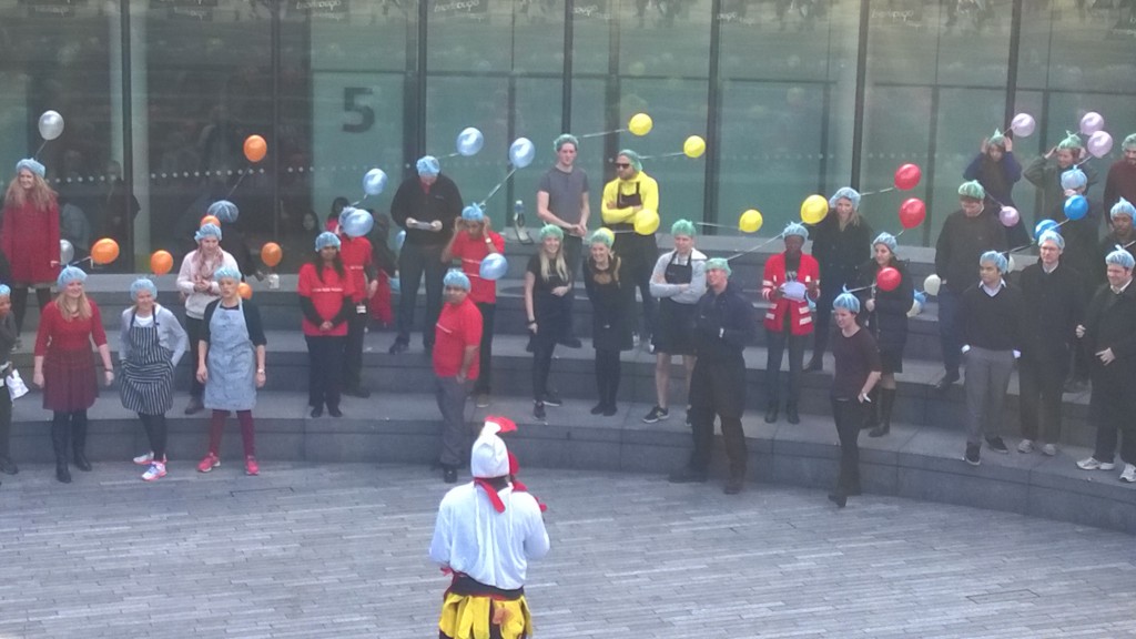 Teams receiving their briefing - from a giant chicken